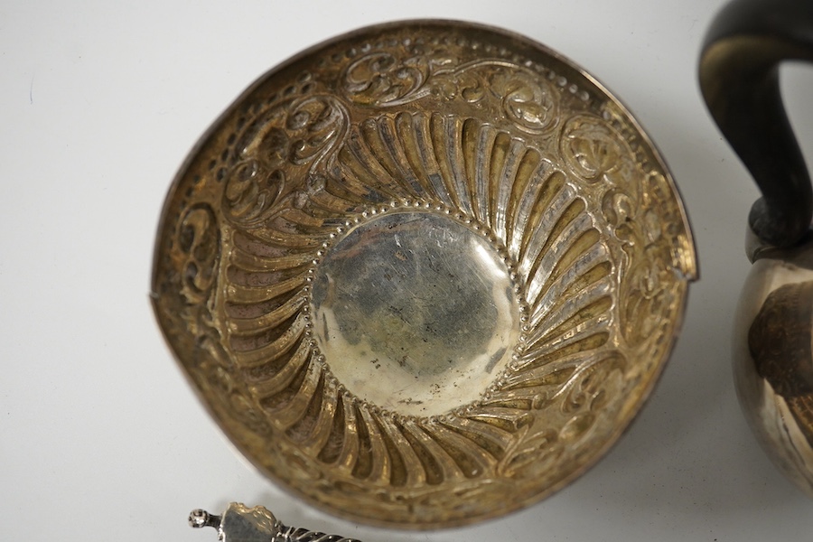 A small French white metal hot water pot, 13cm, a continental white metal bowl (a.f.) and a 19th century German white metal spoon. Condition - poor to fair